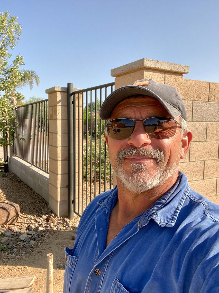 A block wall meeting a view fence at a property corner in Queen Creek, AZ