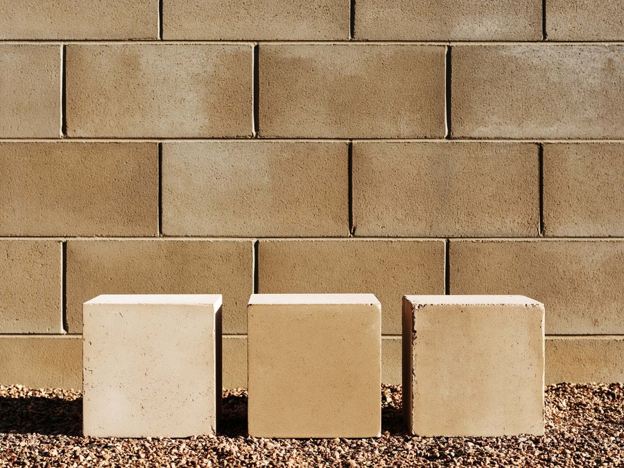 Three sample blocks stood against a weathered wall to match the color in daylight
