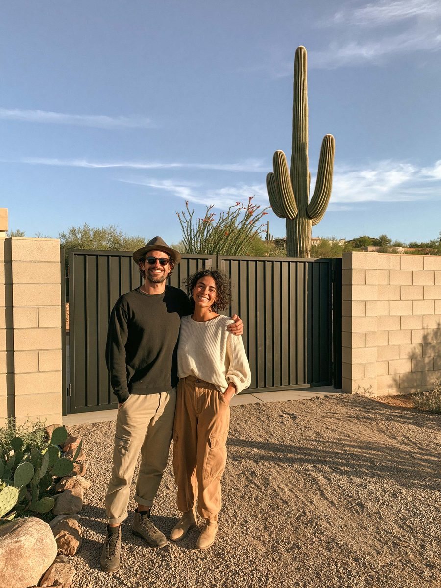 Homeowners in front of a finished block wall with an RV gate set into it, Queen Creek, AZ